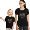 Family Matching Tenues Fashion Family Look Mama Mini T-shirt Print Mère et fille Vêtements Mommy Baby Girls Boys Top Summer Family Matching Tenues T240513