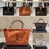 Hoogwaardige designer tas vrouw mode boodschappentas tas afneembare en verstelbare schouderband trek het touw open en dicht gladde koeien lederen schoudertas