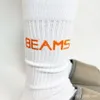 Herrensocken strahlt japanische trendige Markensocken für Herren und Frauen mit mittlerer Länge mitteldickte Handtuchboden Basketball High Top Calf Socken Instagram