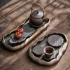 Les ensembles de voies de thé sont une petite cérémonie de plateau de thé à feuilles de lotus ensemble d'imitation rétro-foyer brûlant une poterie grossière à bulles sèches dorées