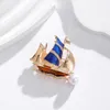 Broches Koreaanse versie van Creative Sail Pearl Broche Alloy Drip Oil Boat Corsage Simple Personality Clothing Accessories