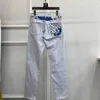 Projektant dżinsów męskich Europejski wiosna/lato białe dżinsy dla mężczyzn Nowa wysokiej jakości wysokiej jakości duża krowa Slim Fit Małe stóp długie spodnie Trendy Youth 1888
