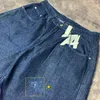 Spodnie damskie vintage niebieskie dotknięte osobowości dżinsy y2k workowate hjgh talia klasyczna prosta retro ulica