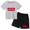 Ensembles de vêtements de 2-12 ans Boys and Girls Letter Imprimé Round Neck Summer Childrens T-shirt + Shorts Set Casual Short Shorts à manches D240514