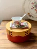Tazze piatto a tazza floreale in barca piatta e cucchiaio caffè a tre pezzi