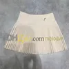 Роскошная плиссированная юбка металлическая буква платье с линией Женщины дизайнерские высокие талию тонкие короткие платья сексуальные мини -юбки