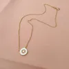 Svarta uppsättningar modehalsband örhängen som original logotyp mässing halsband 18k guld pläterade trendiga smycken ihåliga örhängen för män kvinnor