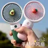 2024SS Summer Mini Fan Portable Handheld Fan Cartoon Cute Student Desktop USB Laddar frukt flera stilar och färger fan