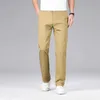 Pantalon masculin de style classique pour hommes pantalon décontracté élastique pas de fer anti-rideaux de couleur solide pantalon droit des vêtements de marque y240514