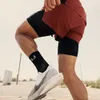 Nouveau short sportif à double couche élastique à taille élastique et à double couche décontractée.