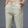 Męskie spodnie wiosną lato nowe swobodne spodnie Mężczyzny Miękki lniany materiał Slim Fit cienki moda szara grn khaki spusty męskie odzież marki 28-38 y240514