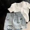 Rokken ontwerper dames rokken zomer mode brief borduurwerk grafische wrap rok hoge taille anti-slip denim korte rok qqmd