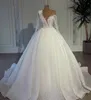 2024 Białe A -Line Beaded Wedding Suknie ślubne Sheer Szyja Koronki długie rękawowe suknie ślubne Arabskie Dubai Cequine Plus Size Vestido de Novia