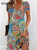基本的なカジュアルドレス2024年のエスニックスタイルのフローラルプリントルーズドレスプラスサイズカジュアルショートスルベプルオーバーVネックドレスY240515のためのヴィンテージの女性ミディドレス
