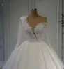 2024 Białe A -Line Beaded Wedding Suknie ślubne Sheer Szyja Koronki długie rękawowe suknie ślubne Arabskie Dubai Cequine Plus Size Vestido de Novia