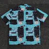 Chemises bleues 2024SS Men Femmes Summer Hawaii Beach Shirt Graffiti Modèle Tops décontractés