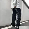 Jeans da uomo strappato jean hip hop man pantaloni tendenze abiti lettera y2k stampa streetwear womens flare goth harajuku largo tendenza calare dhvnm