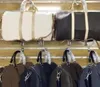 Duffel Bags Minimalistische reistas voor heren Pu Leather Business Short Distance Bagage Women's Handtassen Pak Heren Foldable
