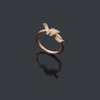 Bandringen Originele grave ontwerper Diamond T Knoop Ring Extravagant 18K Gold Silver Rose 316l roestvrijstalen brief Women Men Men Wedding Sieraden Lady Party Geschenken 6 7 8 9