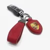 1x Frosted Leder Wildleder Leder Alcantara Auto Car Logo Keychain Keyring Schlüsselhalter für Porsche Autos Schlüsselhülle Schlüsselkette