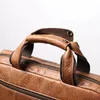 Portafogli Europa e America Retro Valigetta portatile da uomo Borsa a tracolla in pelle di vacchetta di grande capacità Borsa da donna per laptop da 14 pollici