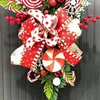 Décoration de fête de Noël en forme de larme florale avec nœud de bonbons et baies rouges, couronne suspendue, porte artificielle