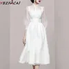 Casual klänningar kvinnor vår vit klänning 2024 cheongsam stativ krage tyll stitching midi kjol av hög kvalitet midja lykta ärm