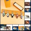 Keychains Lanyards 고급스러운 태양 플라워 베이비 이미지 펜던트 키 체인 트렌디 키 버클 남성 여성 가방 장식품 고품질