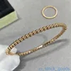 Bracciale rigido di lusso di marca superiore per donna Vanclef v Bracciale con perline di riso in oro Bracciale femminile Seiko Rolling Ball Craft a strati e versatile alla moda