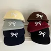 Berretti da baseball Corea all'inizio della primavera Berretto da baseball con fiocco a tesa piatta Versatile Ins Nicchia Design carino Protezione solare Cappelli hip-hop per uomini e donne