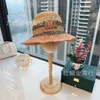 Triumphal Arch 23 Spring/Summer New Contrast Color Grass Knitted Fisherman Hat with Large brim Sun Protection Fashion Light Luxury Style Minimalist Straw Hat
