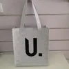 Confezione regalo 100 pezzi all'ingrosso/lotto riutilizzabile logo personalizzato feltro tessuto Tote Shopping Bag donna uomo generi alimentari mano d'affari