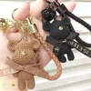 Keychains Lanyards Cute Bear Key Chain Resin Bow Bell Rabbit Keychain Weaving Fashion Doll Bag Pendant Holiday Car Ring for Girls Gift J240330