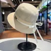 Celebrity Xiaoxiangfeng Tempérament élégant chapeau haut de gamme Femme / été coton et chanvre Chapeau de pêcheur respirant Version coréenne Bow Sun Visor Hat