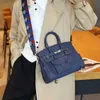 2024 nuova borsa da donna in vera pelle con inserto in tela moda tracolla a forma di onda borsa a tracolla diagonale singola portatile