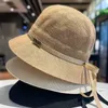 Celebrity Xiaoxiangfeng Tempérament élégant chapeau haut de gamme Femme / été coton et chanvre Chapeau de pêcheur respirant Version coréenne Bow Sun Visor Hat