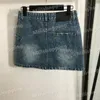 Oregelbundna fickor denim kjolar kvinnor designer kläder brev jacquard kort klänning hip hop street stil mini kjol jean