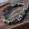 Charm-Armbänder, schwarze Farbe, Paracord-Armband, kreative Geschenkschnur, grüner Totenkopf-Armreif, Schmuckzubehör, gewebt