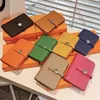 Guangzhou 2024 New Mid length Top Layer Cowhide Litchi Pattern Money Clip Circular Buckle Drawstring Wallet for Women Purse