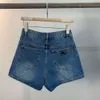 Rak 2023 sommar ny triangeletikett denim shorts kvinnor hög midja bantning mångsidig lös bred benbyxor