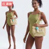 새로운 수제 짠 잔디 짠 어깨 가방 편지 중공 핸드백 여성의 여름 해변 토트 가방 240402