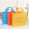 Emballage cadeau promotionnel supermarché événement cadeaux sacs d'emballage réutilisables non tissés emballage cadeau sac de friandises faveur de fête économique