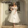 ESCIGLIO RODDRSYA BLING GLITTER BOHO Abiti da sposa per donne fuori spalla Sweeteaart Tulle Beach Beach Tè Abito da sposa allacciata