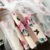 Femmes Survêtements Été Femmes Nouvelle Mode Irregar Cross Bow Tie T-shirt Ajouter Vintage Fleur Imprimer Jupe Fille Lady Deux Pièces Ensembles Gilet Dh1J2