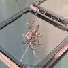 ピンクのダイヤモンドラブプラネットネックレス