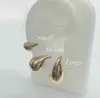 Stud 2024 di alta qualità nuovo semplice geometrico alto lucido colore oro metallo fascino cerchio Huggie orecchino grosso gioielli da sposa da donna Q240402
