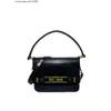 Omuz çantası tasarımcısı Amerikan trend markası basit ve modaya uygun düz renkli timsah desen metal küçük kare çanta el tipi bir crossbody bayan