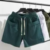 Shorts masculinos elásticos na cintura ajustável verão no verão com bolsos de cordão para