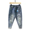 Streetwear rippade jeans för män Spring mode vintage byxor Lossa nödläge Motorcykelhålen denimbyxor 240325