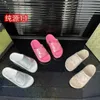 18% OFF Designer Thick sole sponge cake one line slippers women for external wear flat bottomed elevated sandals beach shoes trend